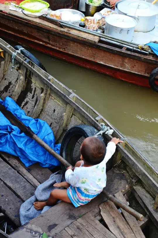 This boat had a lady, her husband, and her adorable child.